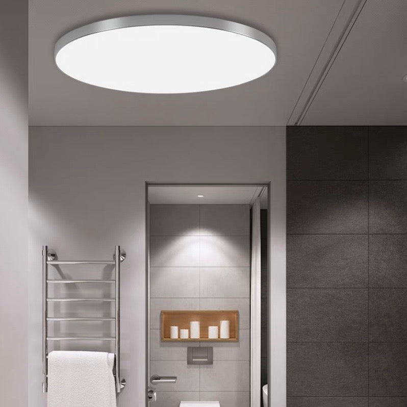 Gray round flat LED flush-mount ceiling light with white diffuser panel