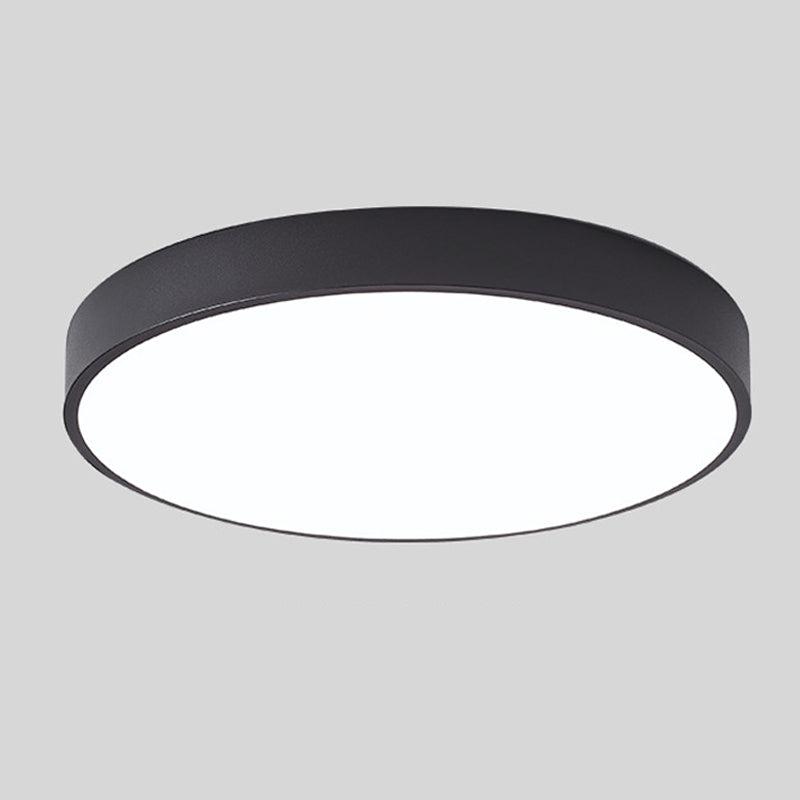 Round ceiling light with white acrylic diffuser and dark metal rim