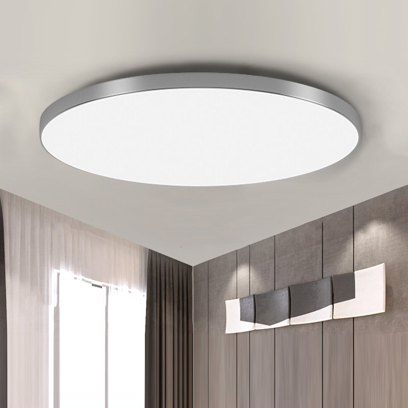 Silver-toned round LED flush-mount ceiling light with flat acrylic diffuser