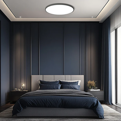 Round flat LED flush-mount ceiling light with white diffuser plate
