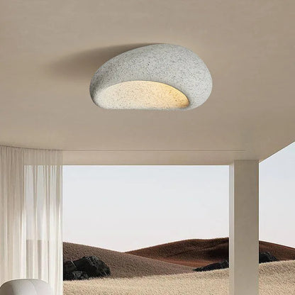 Rustic LED ceiling light in light gray textured metal, low-profile round flush mount with warm glow
