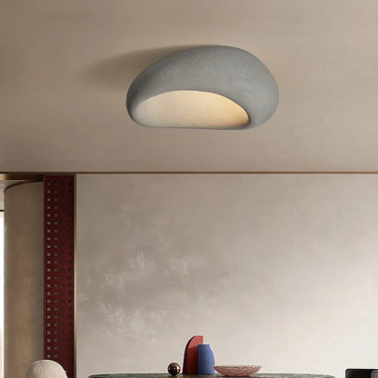 Rustic LED ceiling light in dark gray textured metal, compact flush mount with warm glow
