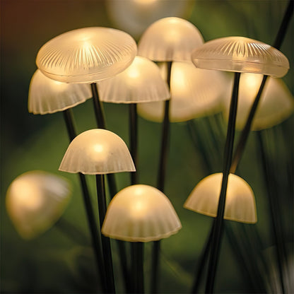 Solar LED mushroom garden lights with glowing beige caps on black stakes