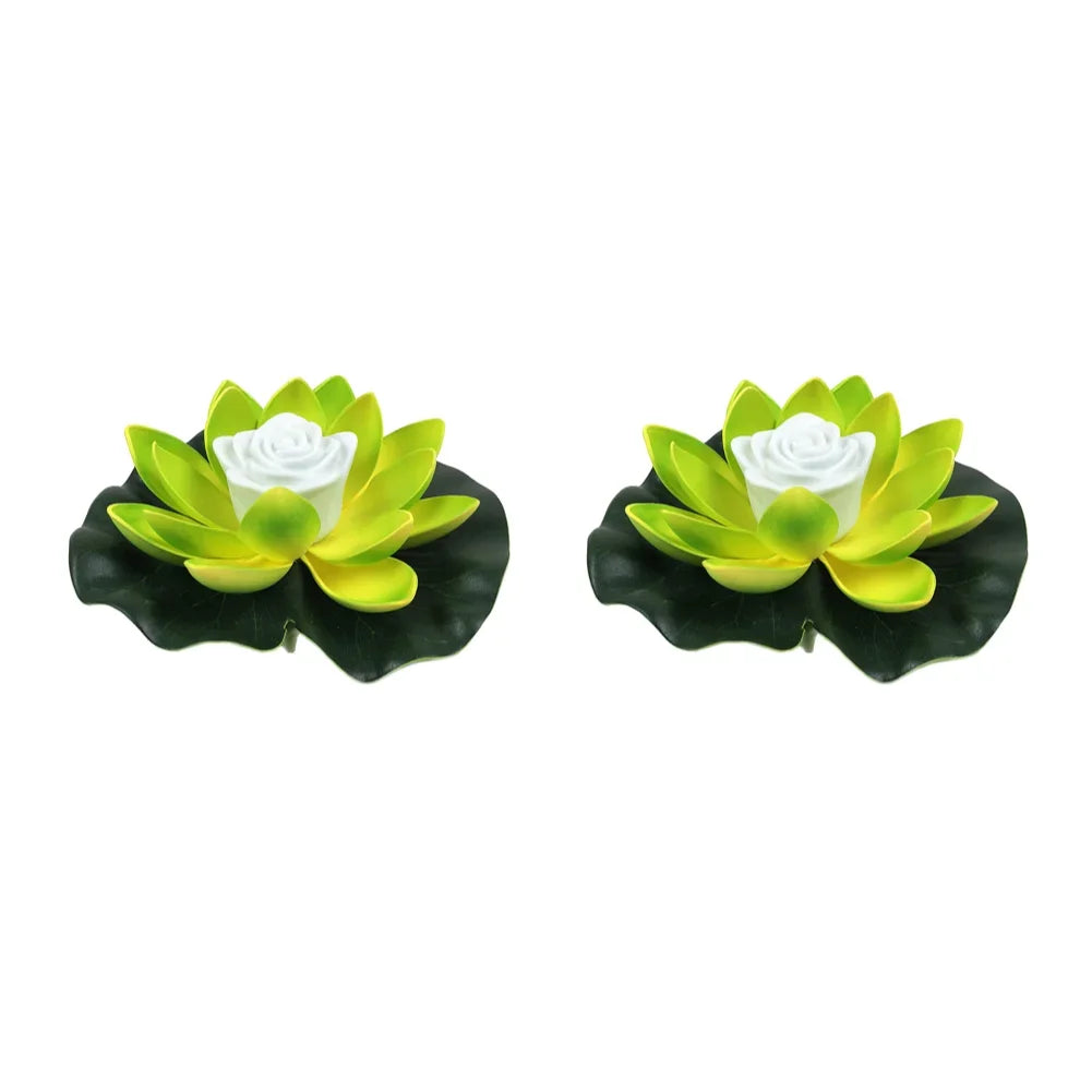 Pair of green floating lotus pond lights with white center roses and dark leaves
