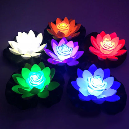 Set of glowing floating lotus LED pond lights with white, purple, green, red, and blue tones