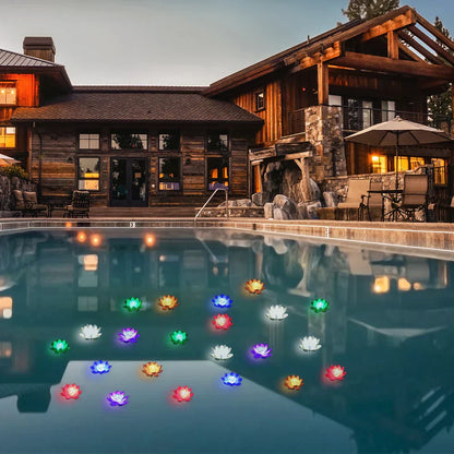 Set of glowing floating lotus pond lights in multiple colors across pool water