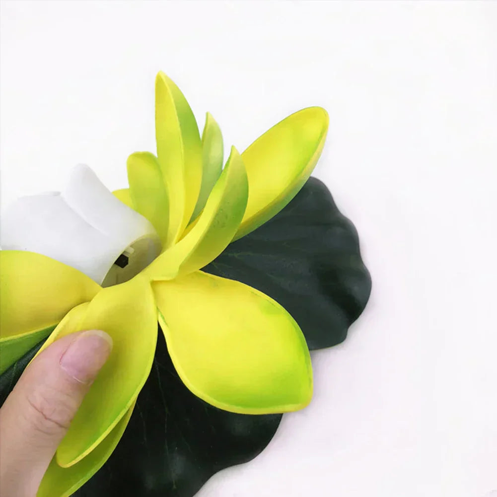 Yellow floating lotus pond light with white center rose and dark green leaves