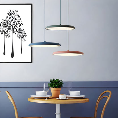 Set of three metal pendant lights with mixed shades: white, black, and rose gold