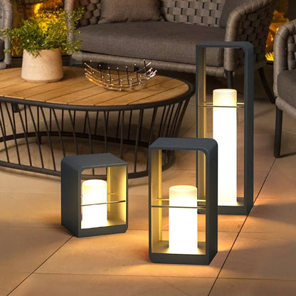 Black metal LED outdoor lantern light with warm bulb glow, square glass frame