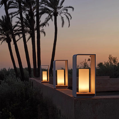 Tall black metal LED outdoor lantern light with warm glow, rectangular glass panels