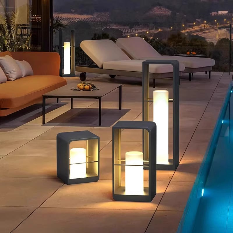 Black metal LED outdoor lantern light with warm glow, cube-shaped glass housing