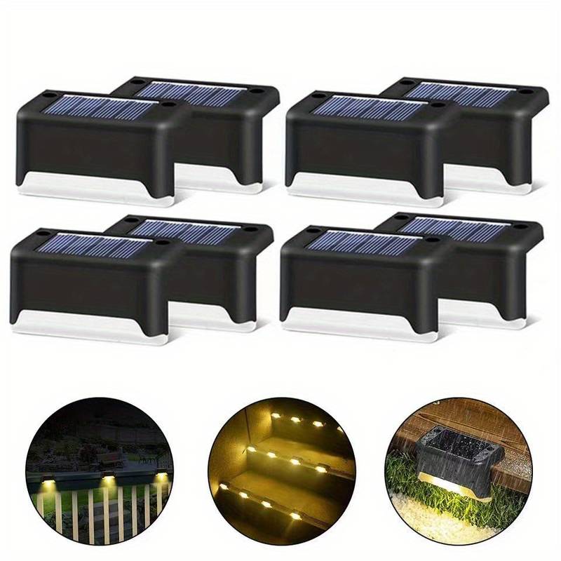 Set of four solar LED wall lights with black housings and solar panel tops