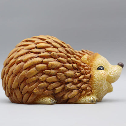 Solar hedgehog garden light figure in brown resin, curled shape with LED-ready face