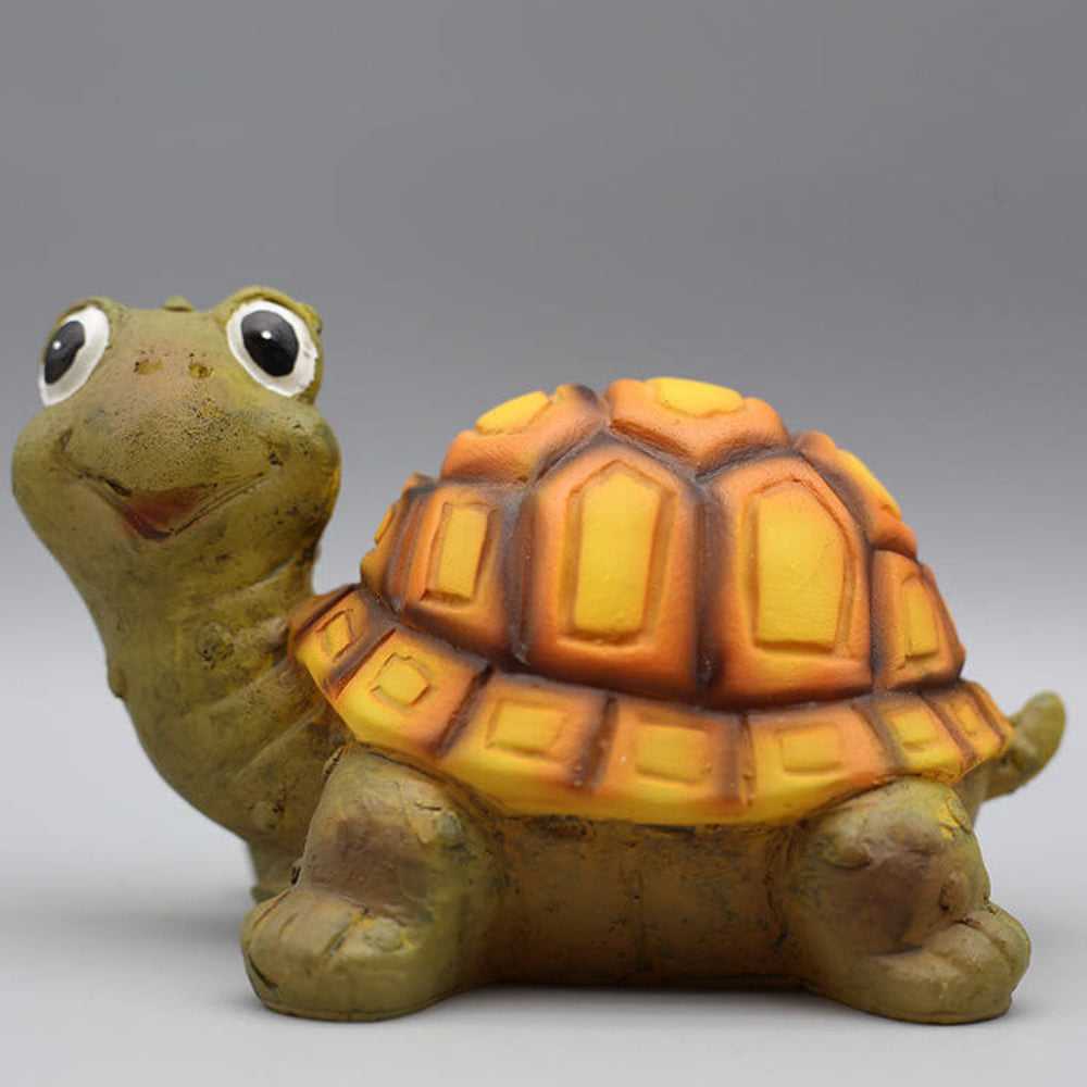 Solar turtle garden light figure in brown resin, LED glow over garden leaves
